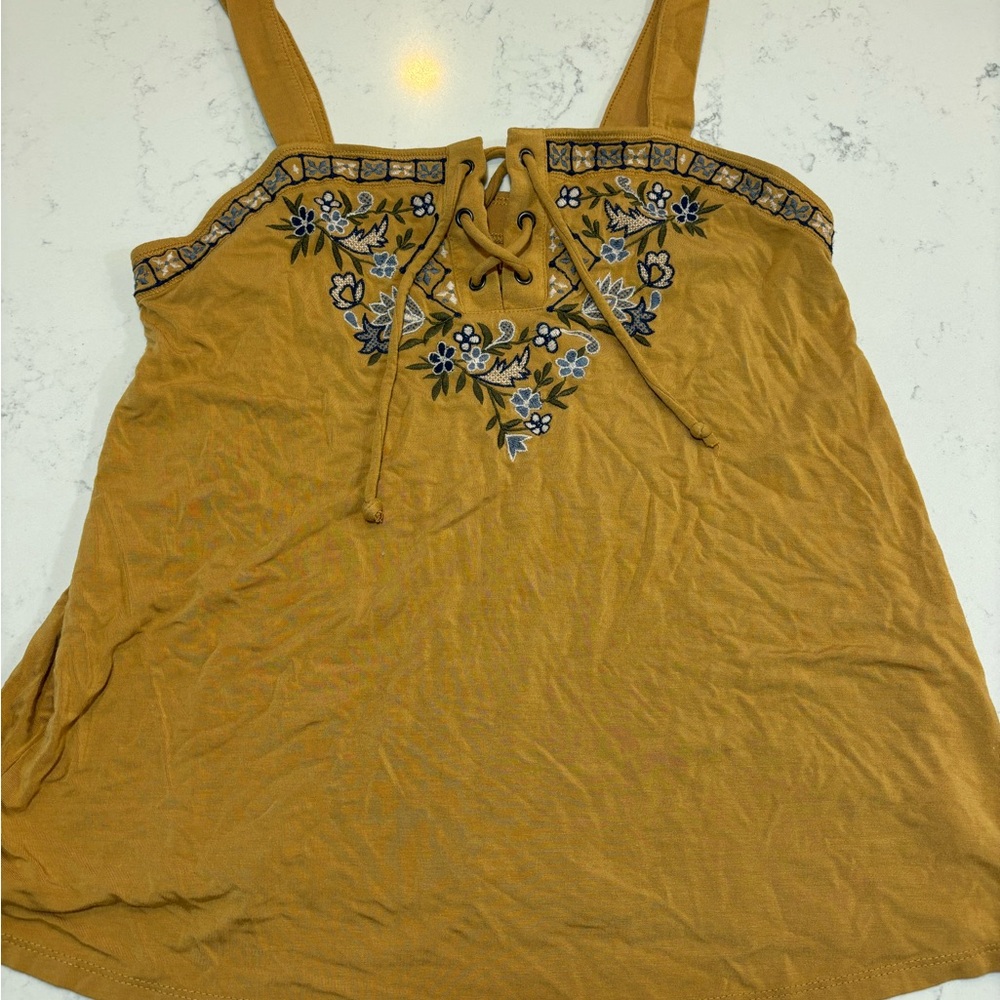 Soft and sexy tank top with embroidery and lace up details